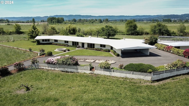 drone / aerial view with a mountain view and a rural view