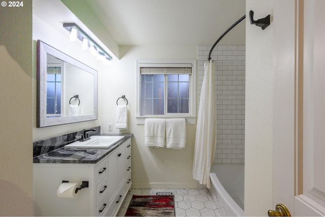 bathroom with tile patterned flooring, vanity, and shower / bathtub combination with curtain