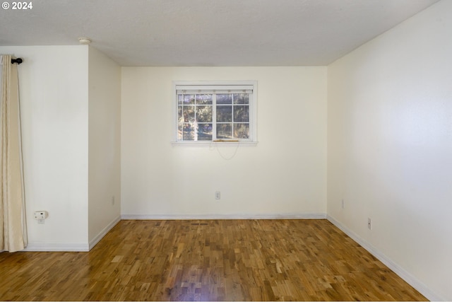 empty room featuring hardwood / wood-style floors