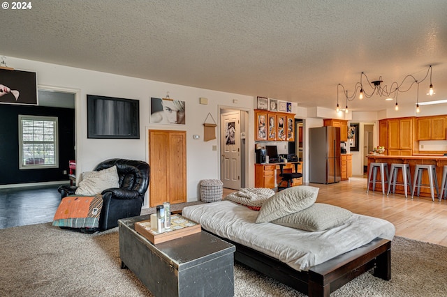 living room featuring hardwood / wood-style flooring and a textured ceiling