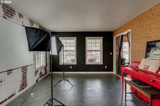 miscellaneous room featuring a textured ceiling