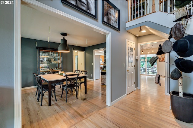 dining space featuring wood-type flooring