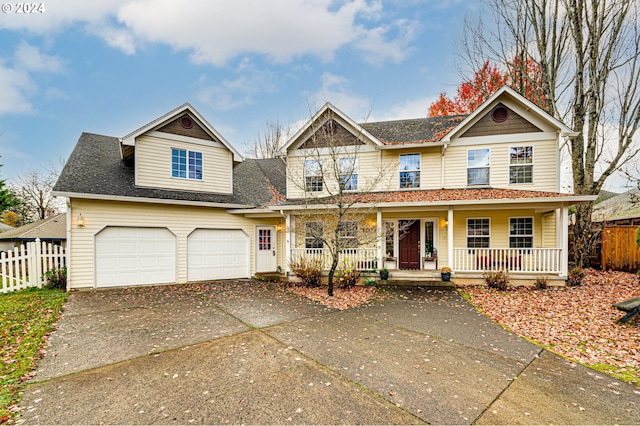 view of front of house with a porch and a garage