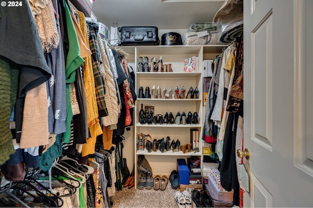 spacious closet with carpet flooring