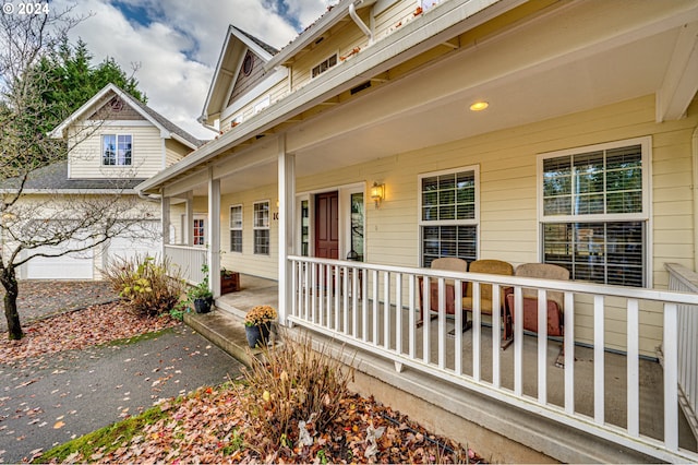 view of exterior entry with a porch