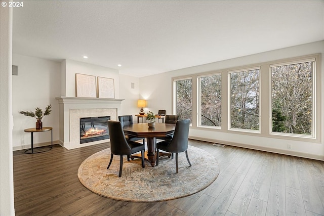 dining space with dark hardwood / wood-style flooring