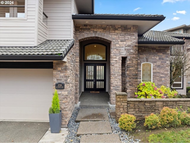 property entrance featuring a garage