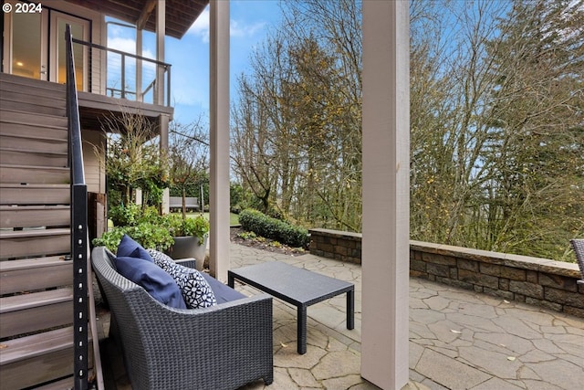 view of patio / terrace with a balcony and an outdoor hangout area