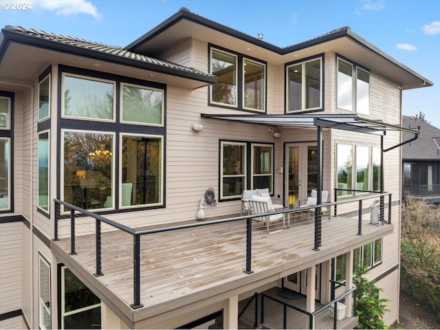 rear view of property with a wooden deck