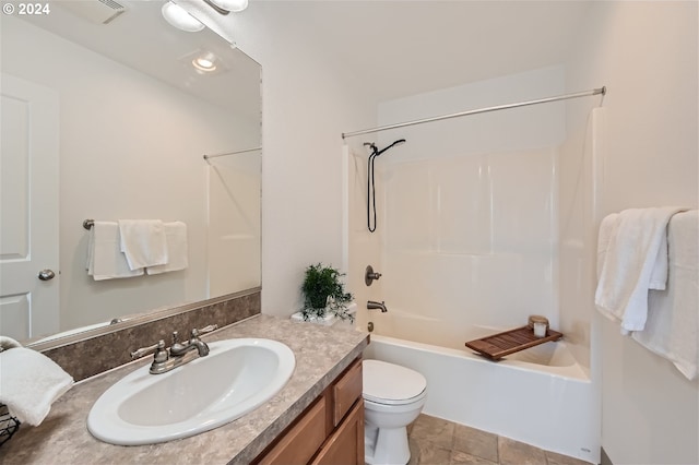 full bathroom featuring shower / washtub combination, vanity, and toilet