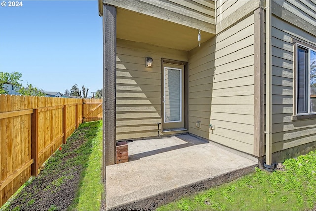 entrance to property featuring a patio area