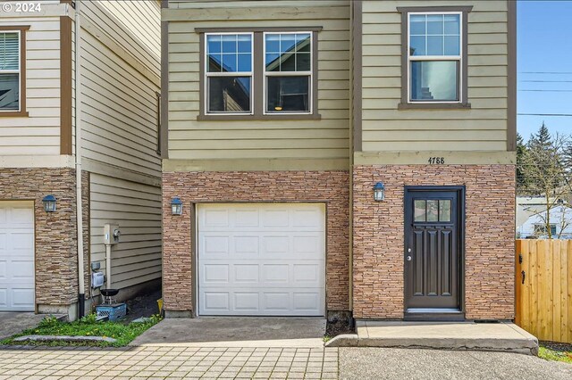 entrance to property featuring a garage