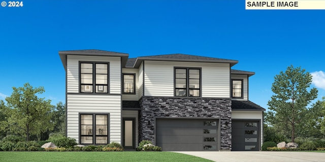 view of front facade with a garage and a front lawn