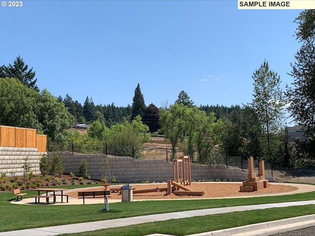 view of jungle gym featuring a lawn