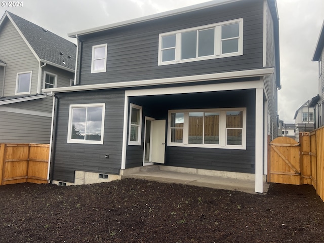 rear view of property featuring a patio area