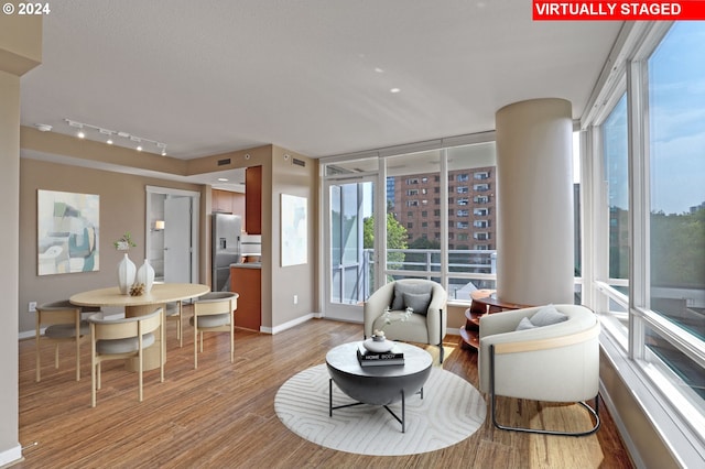 interior space featuring hardwood / wood-style floors and track lighting