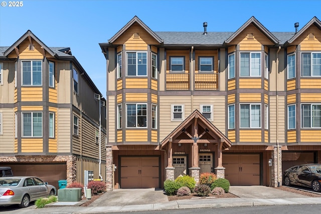 19639 SW Blackbear Ct, Beaverton, OR 97006 - multi unit property featuring a garage, stone siding, and driveway
