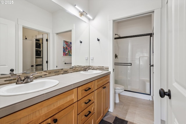 19639 SW Blackbear Ct, Beaverton, OR 97006 - full bathroom with a shower stall, double vanity, and toilet