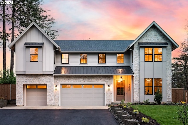 modern inspired farmhouse featuring a garage