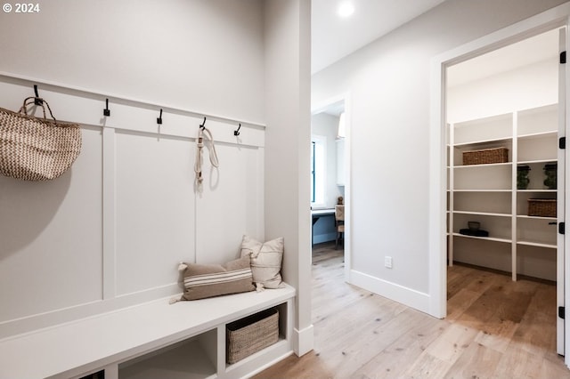 mudroom with light hardwood / wood-style flooring