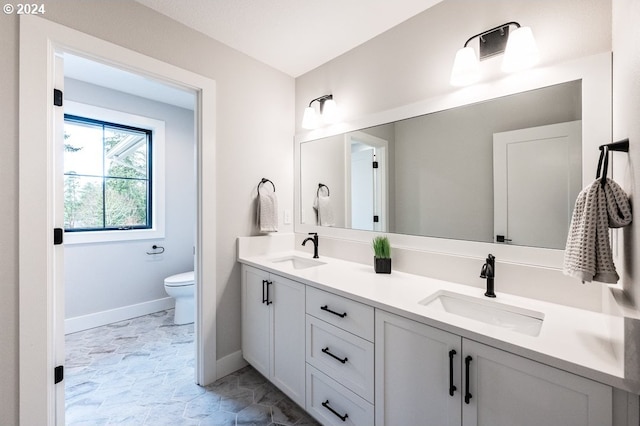 bathroom with vanity and toilet