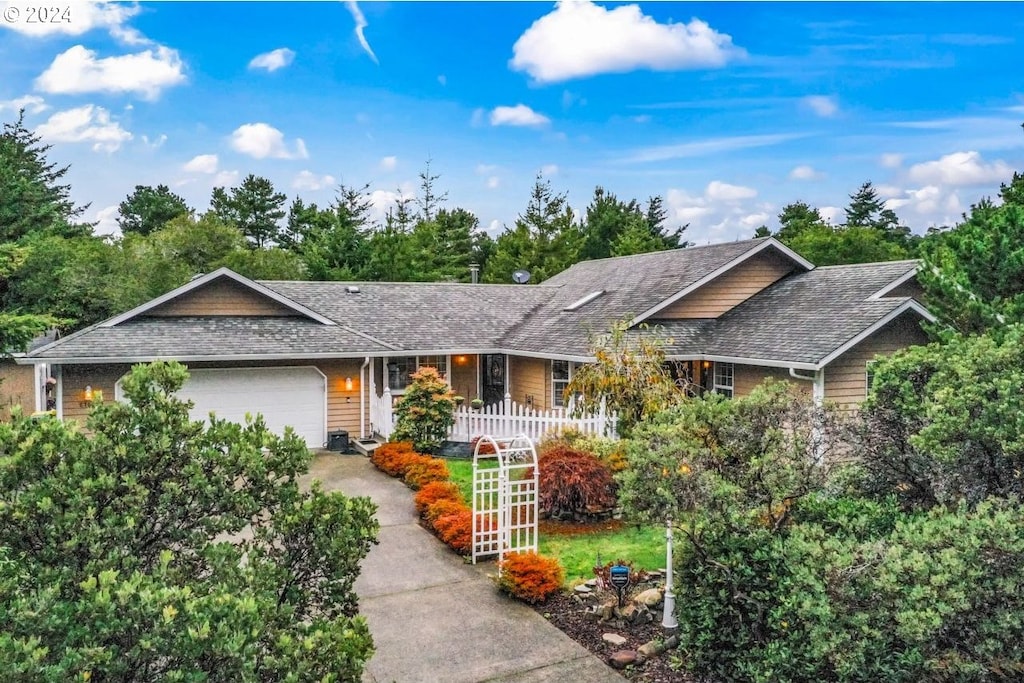 ranch-style home featuring a garage