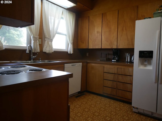 kitchen with sink and white appliances