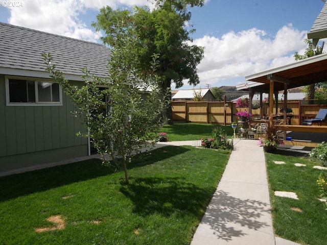 view of yard with a wooden deck