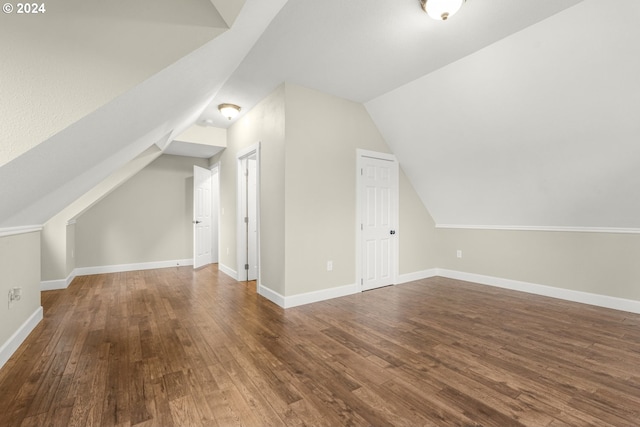 bonus room featuring lofted ceiling and wood-type flooring