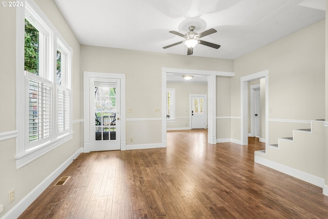 empty room with wood-type flooring and ceiling fan