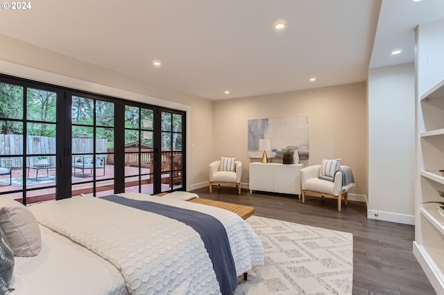 bedroom with multiple windows, french doors, access to exterior, and dark hardwood / wood-style flooring