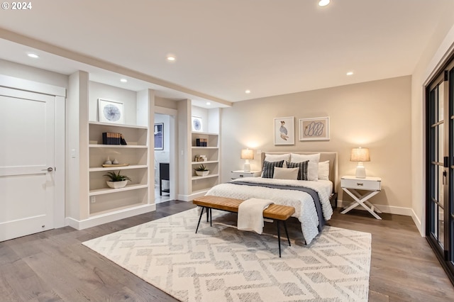 bedroom with wood-type flooring and a closet