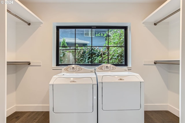 washroom featuring washing machine and dryer and dark hardwood / wood-style floors