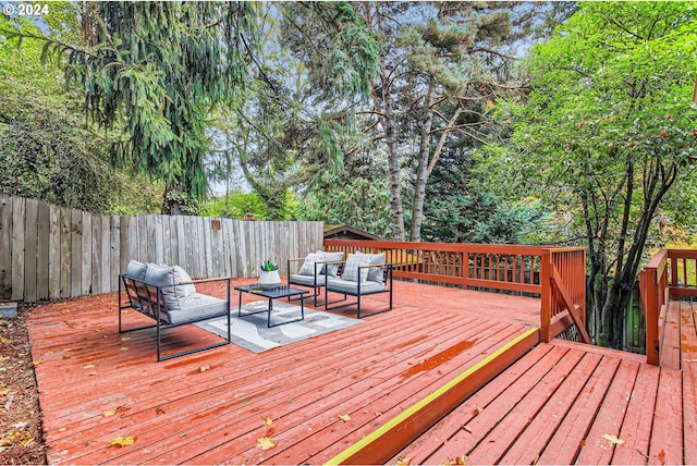 wooden terrace featuring an outdoor hangout area