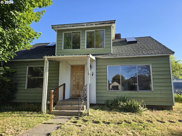 view of front of home with a front yard