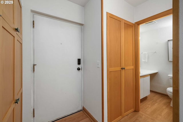 doorway to outside featuring light hardwood / wood-style flooring