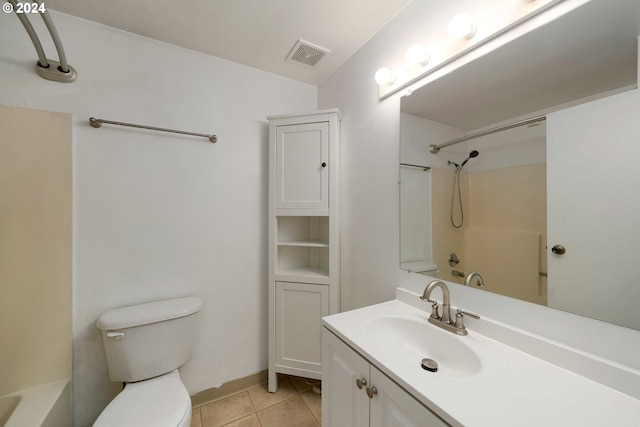 full bathroom featuring bathtub / shower combination, vanity, toilet, and tile patterned floors