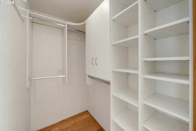 walk in closet featuring hardwood / wood-style floors