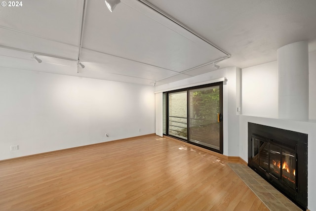 unfurnished living room with light wood-type flooring