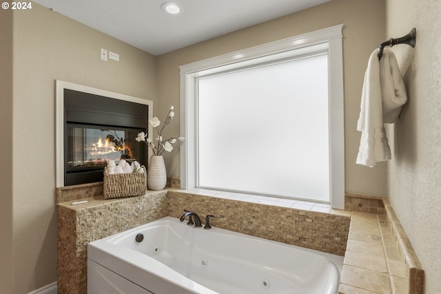 bathroom featuring a tub to relax in