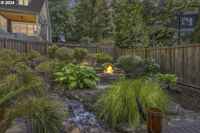 view of yard with an outdoor fire pit