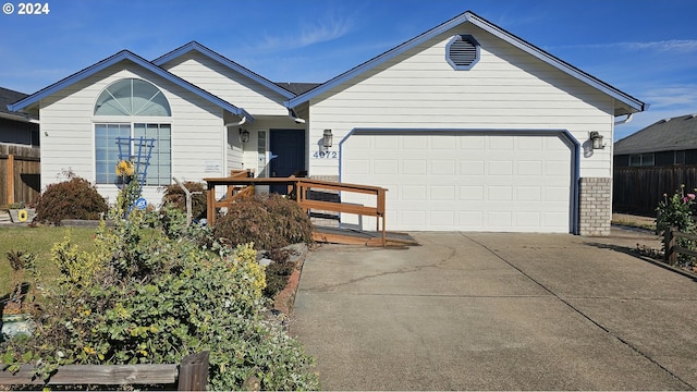 ranch-style house featuring a garage