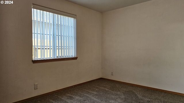 4072 Forsythia St, Springfield, OR 97478 - empty room featuring dark carpet and baseboards