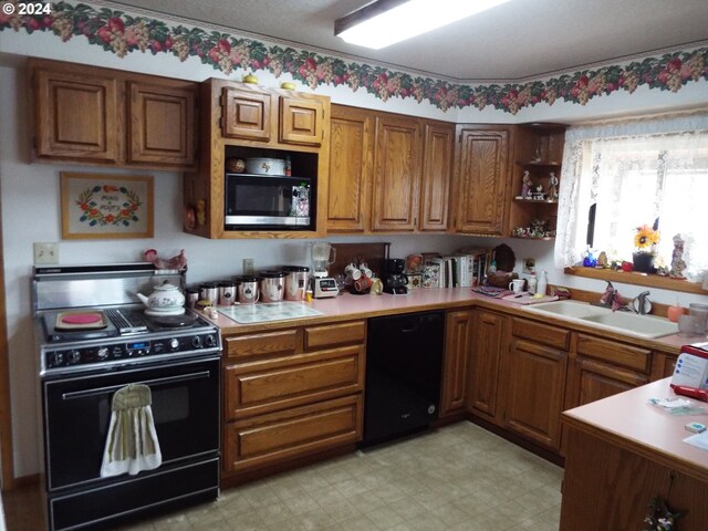 kitchen featuring sink and black appliances