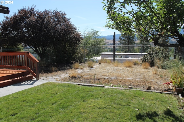 view of yard with a wooden deck