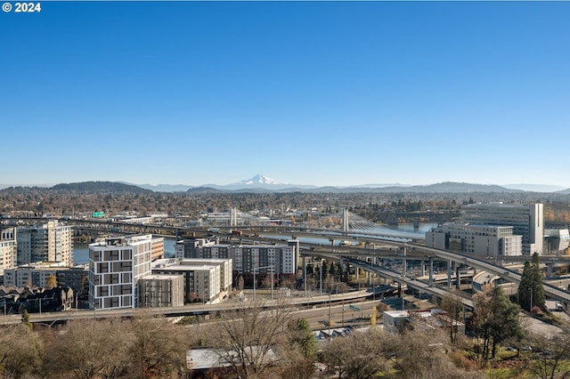 city view featuring a water and mountain view