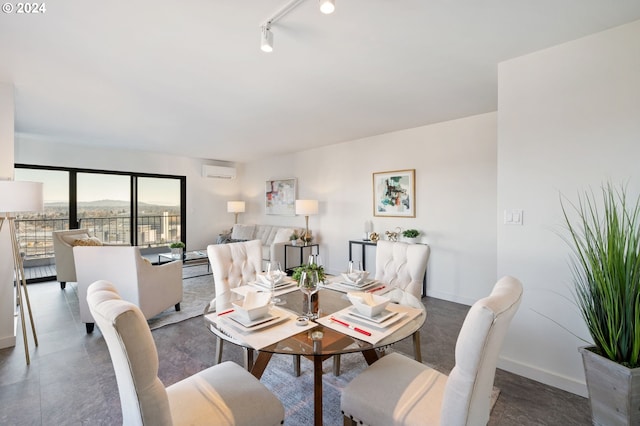 dining room with track lighting and a wall mounted AC