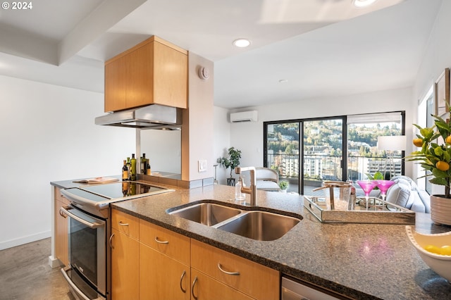 kitchen with exhaust hood, dark stone counters, stainless steel electric stove, sink, and a wall unit AC