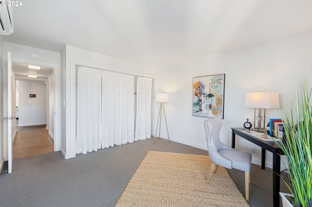 2221 SW 1st Ave Unit 1622, Portland, OR 97201 - office area featuring carpet floors, a wall unit AC, and baseboards