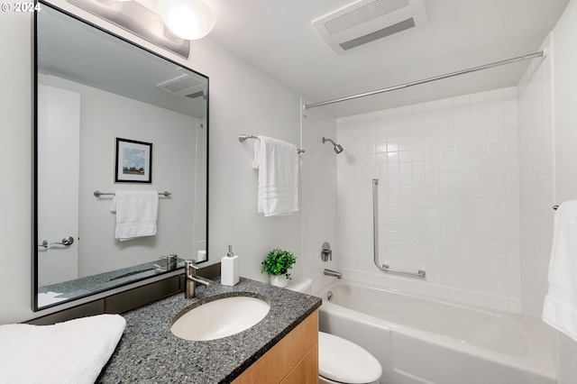 full bathroom with vanity, toilet, and tiled shower / bath